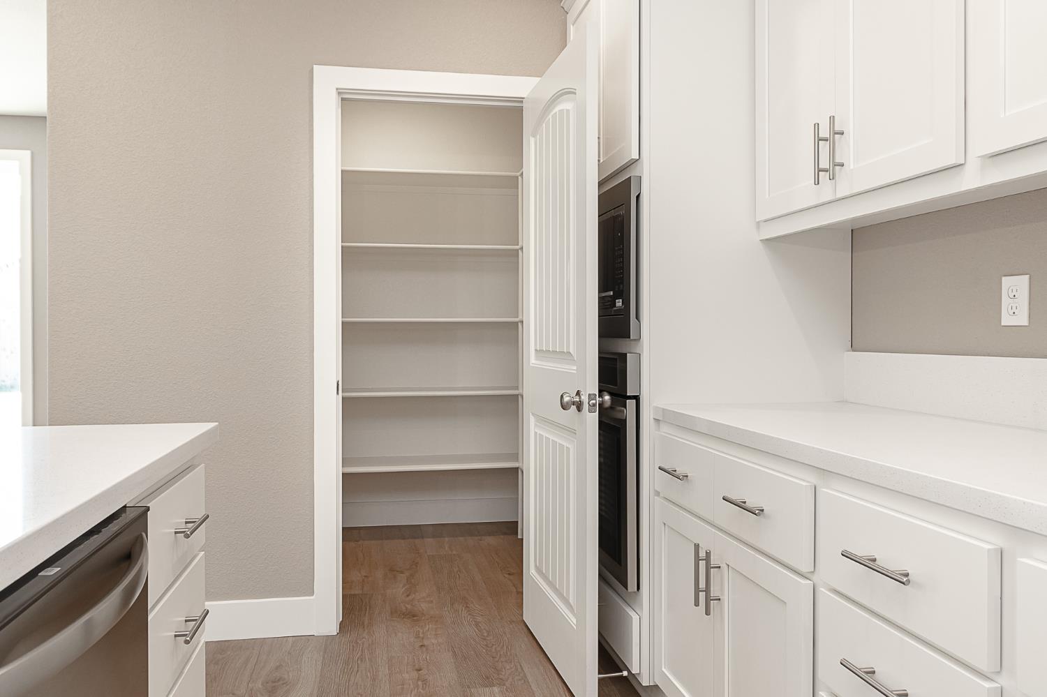 1310 Veteran Street Manteca, CA 95337 - Photo 13 of 33 a view of cabinets with wooden floor