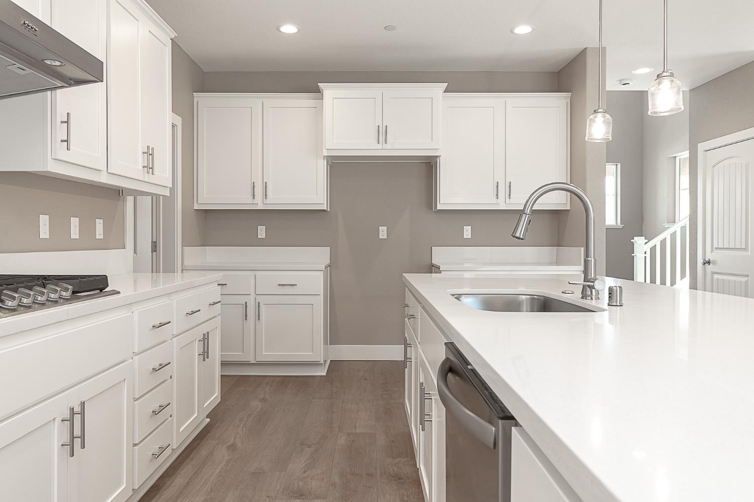 1310 Veteran Street Manteca, CA 95337 - Photo 15 of 33 a kitchen with white cabinets and white appliances