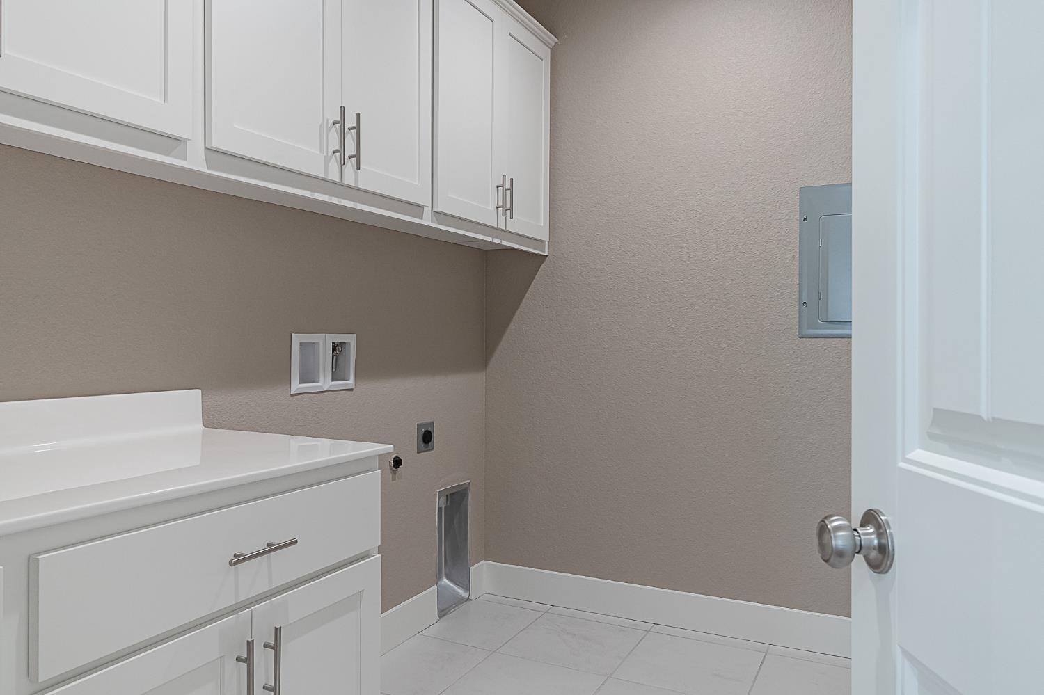 1310 Veteran Street Manteca, CA 95337 - Photo 16 of 33 a bathroom with a sink and cabinets