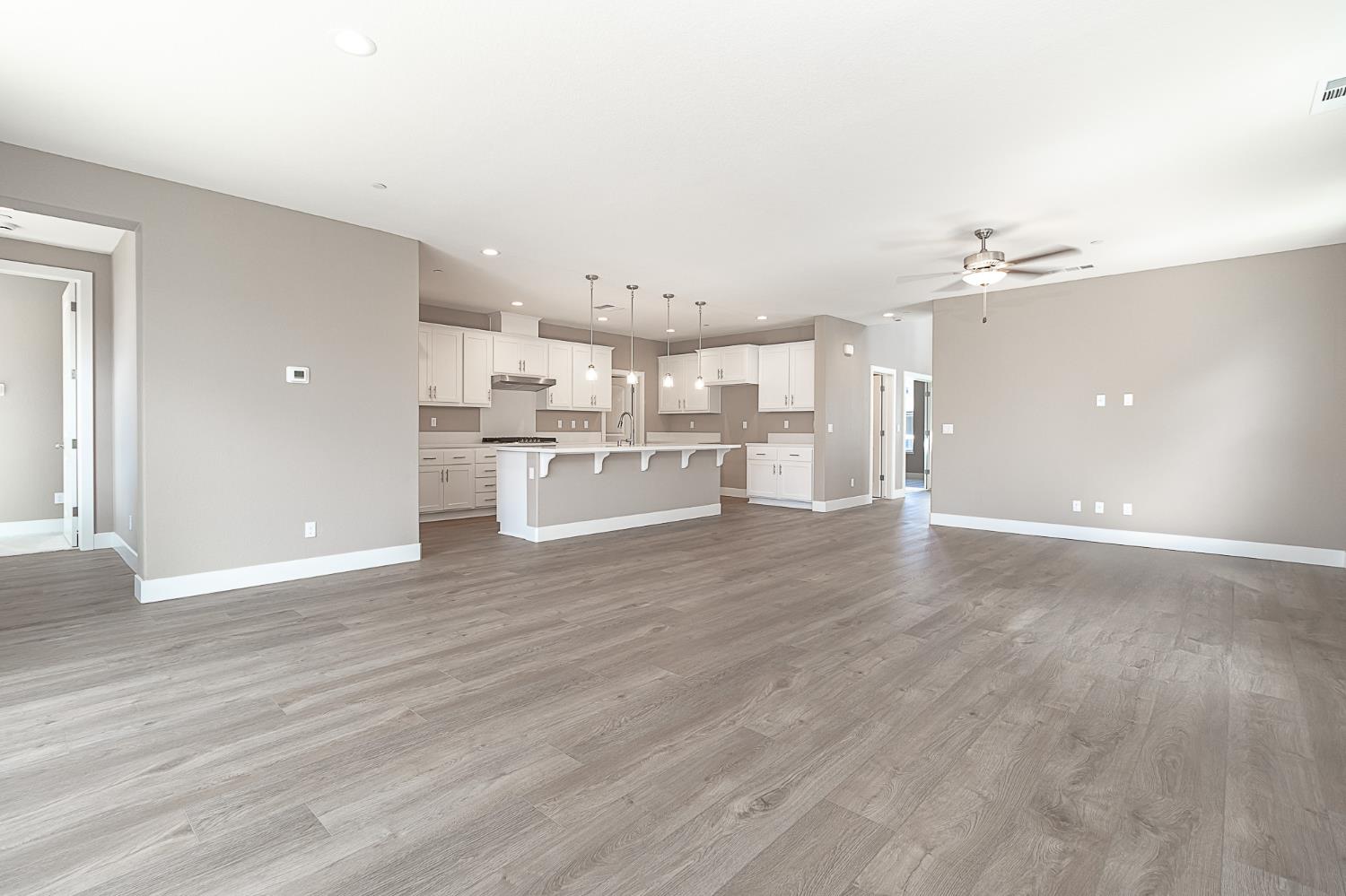 1310 Veteran Street Manteca, CA 95337 - Photo 18 of 33 a view of a kitchen with a sink and a refrigerator
