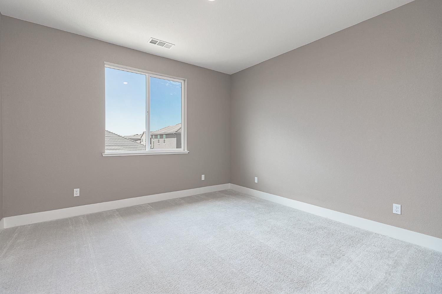 1310 Veteran Street Manteca, CA 95337 - Photo 30 of 33 an empty room with windows and closet