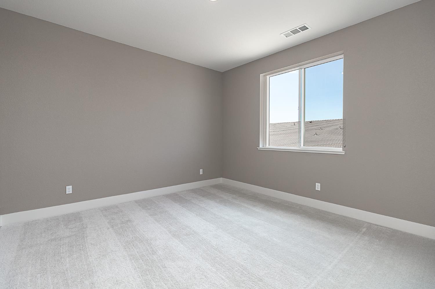1310 Veteran Street Manteca, CA 95337 - Photo 31 of 33 an empty room with a window