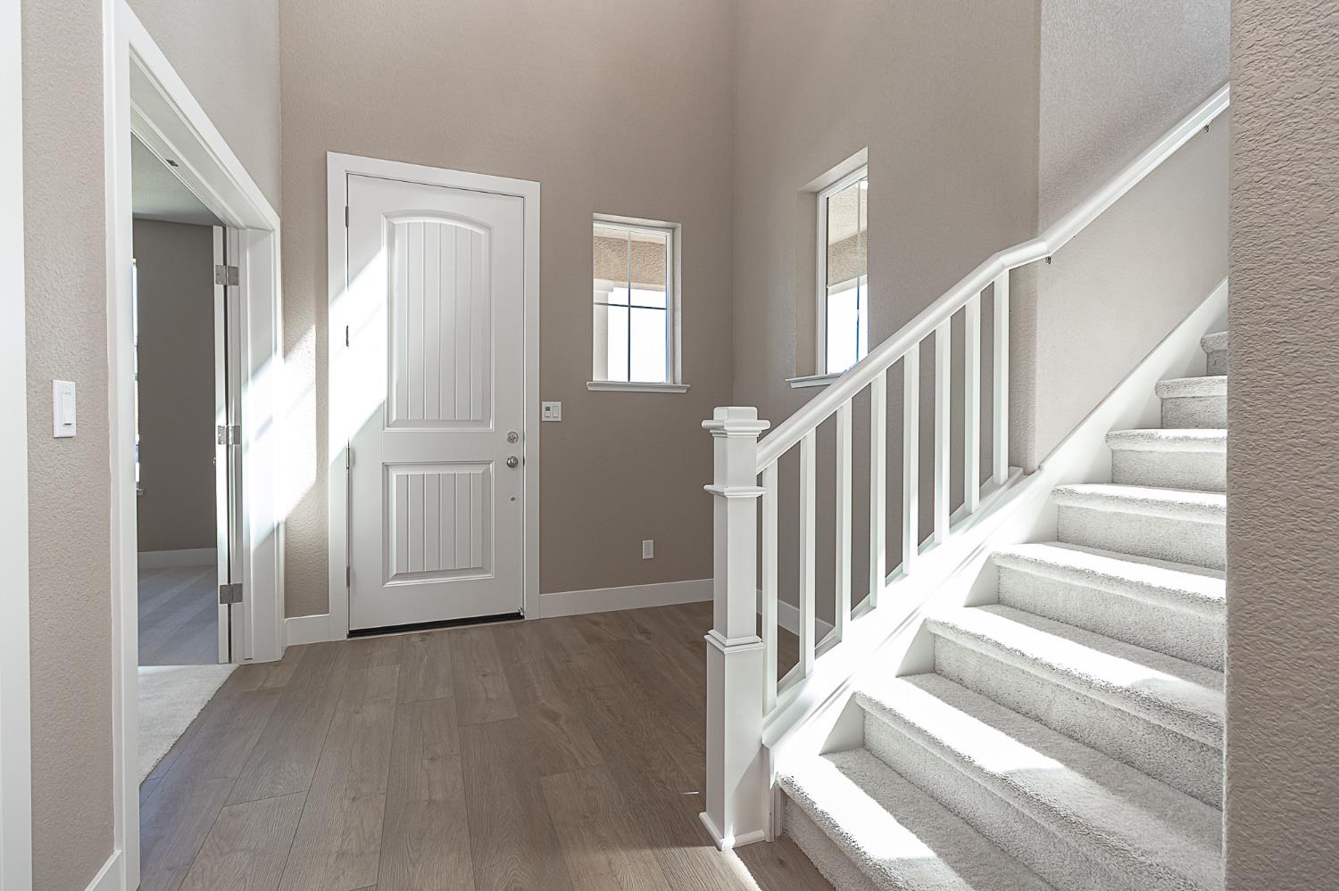 1310 Veteran Street Manteca, CA 95337 - Photo 5 of 33 a view of staircase with white walls and windows
