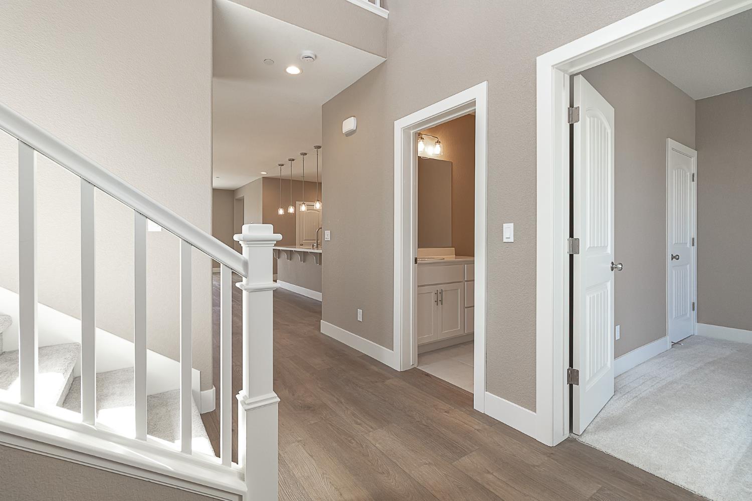 1310 Veteran Street Manteca, CA 95337 - Photo 7 of 33 a view of entryway and hall with wooden floor