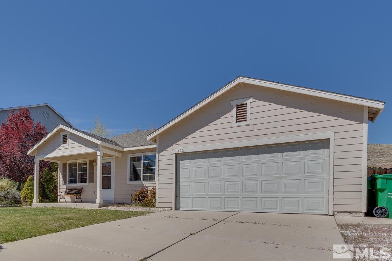 4061 Kings Row Reno, NV 89503 - Photo 1 of 1 a front view of a house with a yard