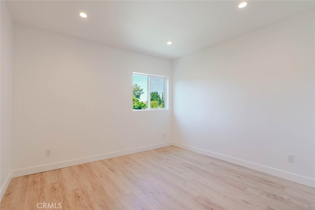 6835 Yolanda Avenue Reseda, CA 91335 - Photo 20 of 34 a view of an empty room with wooden floor and a window