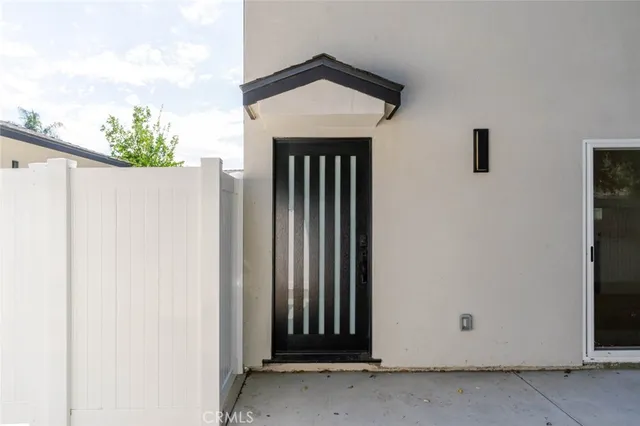 a view of a entryway door front of a house