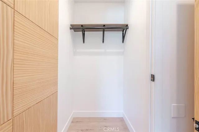 a view of backyard with a garden and palm trees