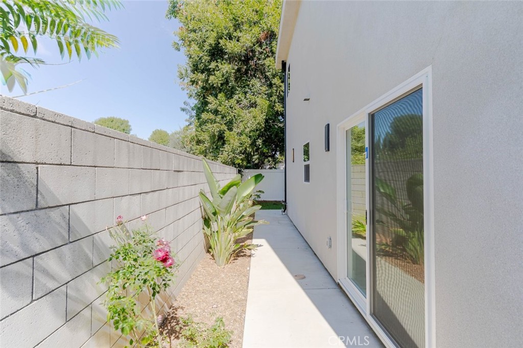 6835 Yolanda Avenue Reseda, CA 91335 - Photo 27 of 34 a potted plant sitting in front of a door