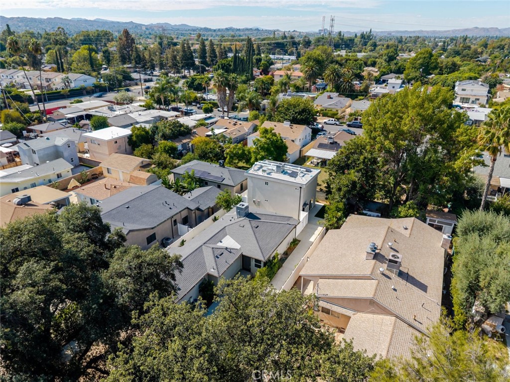 6835 Yolanda Avenue Reseda, CA 91335 - Photo 32 of 34 an aerial view of residential house with parking and trees