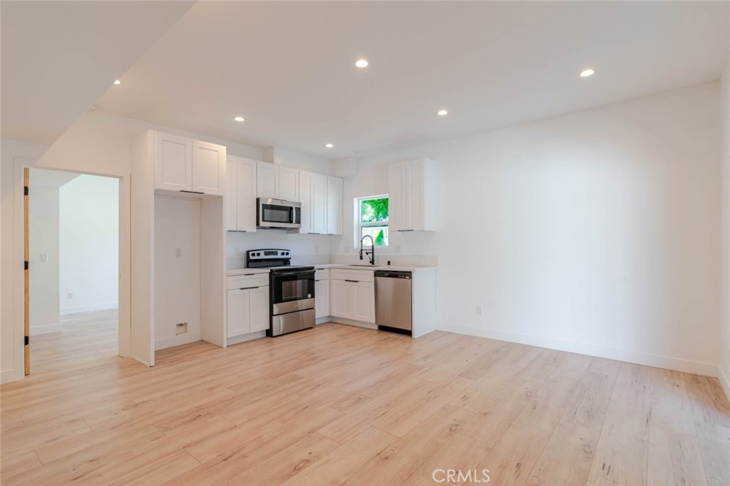 6835 Yolanda Avenue Reseda, CA 91335 - Photo 4 of 34 a kitchen with a refrigerator and a stove top oven