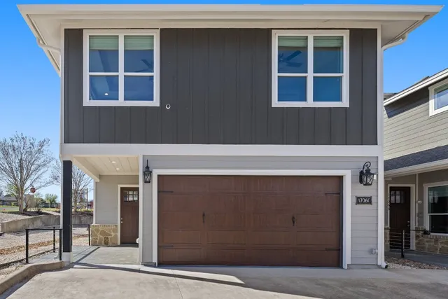 a front view of a house with a garage