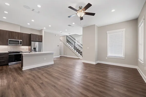 a view of kitchen with sink and wooden floor