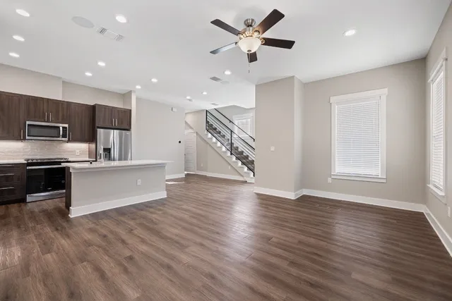 a view of kitchen with sink and wooden floor