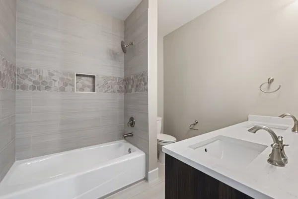 a bathroom with a sink and a bathtub