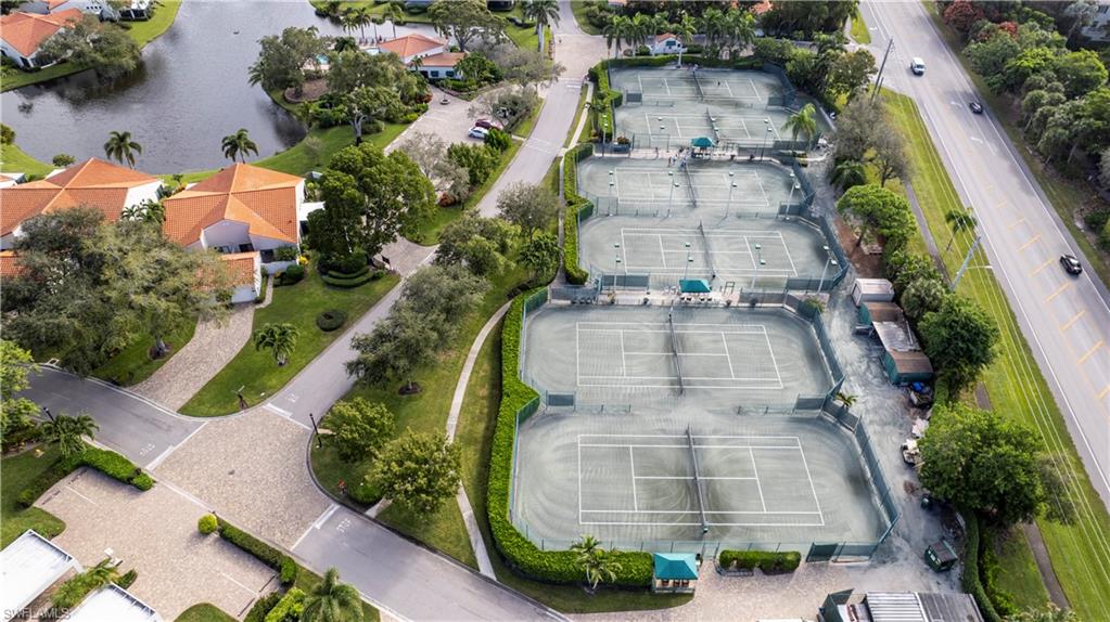637 Beachwalk Circle, Unit E203 Naples, FL 34108 - Photo 20 of 30 an aerial view of a house with a yard