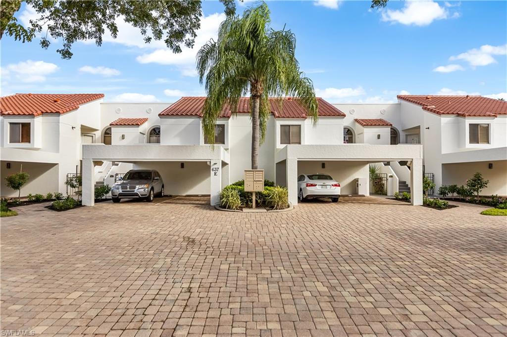637 Beachwalk Circle, Unit E203 Naples, FL 34108 - Photo 26 of 30 a car parked in front of a house