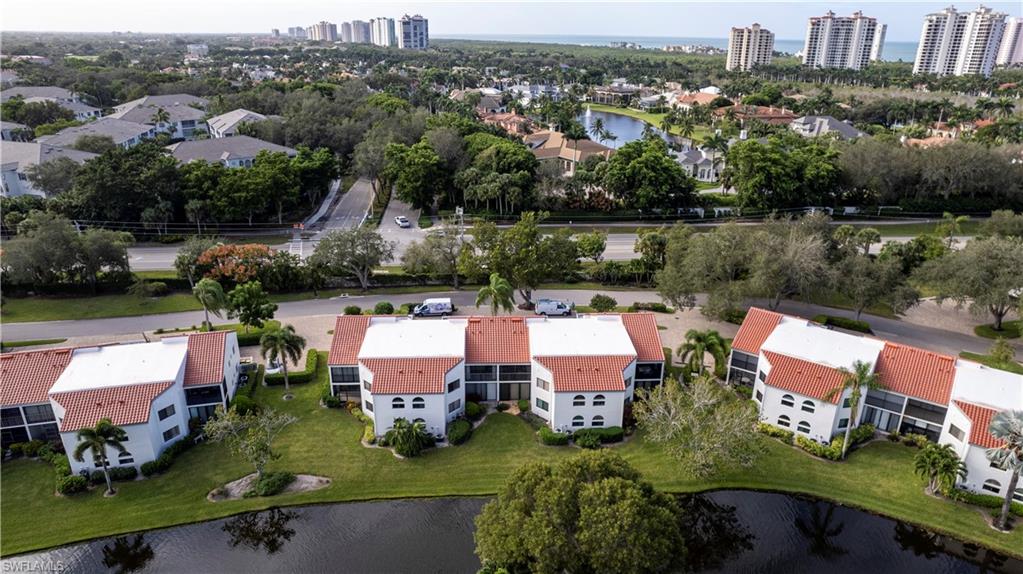 637 Beachwalk Circle, Unit E203 Naples, FL 34108 - Photo 30 of 30 an aerial view of a house with lake view