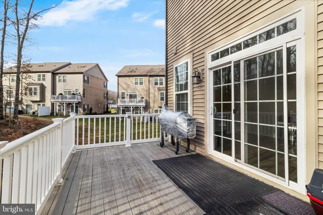 a view of a balcony with wooden floor