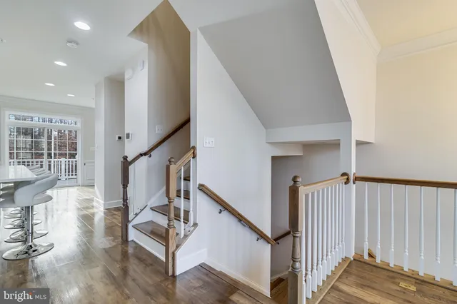 a view of entryway with wooden floor and stairs