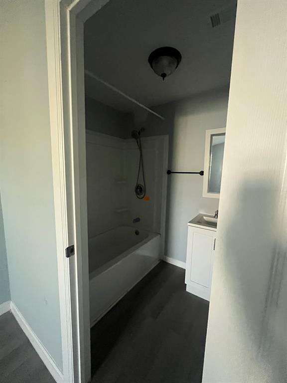 108 North Ash Street Springtown, TX 76082 - Photo 13 of 22 a bathroom with a bathtub and a shower