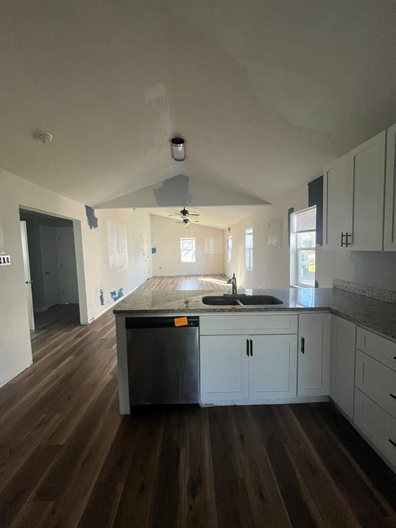 108 North Ash Street Springtown, TX 76082 - Photo 17 of 22 a large white kitchen with a sink and dishwasher stove top oven