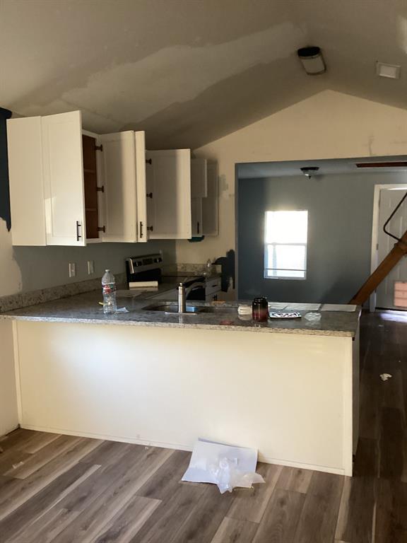 108 North Ash Street Springtown, TX 76082 - Photo 4 of 14 a view of kitchen with stainless steel appliances wooden floor and window