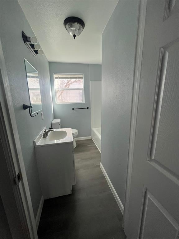 108 North Ash Street Springtown, TX 76082 - Photo 6 of 22 a room with a sink and mirror