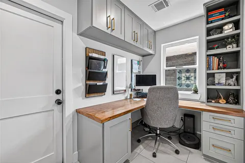 a workspace with furniture and window