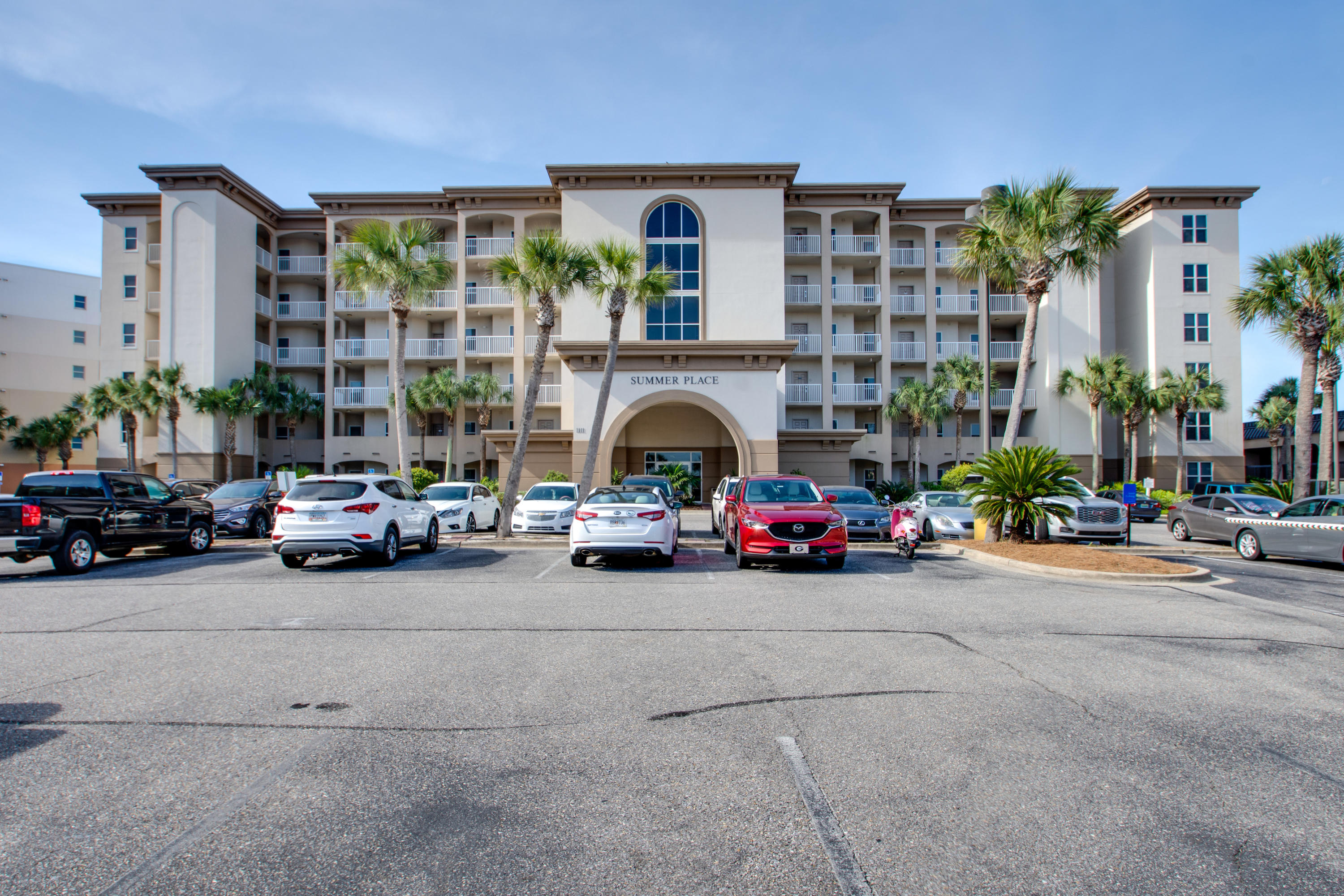 a view of a car is parked in front of a building