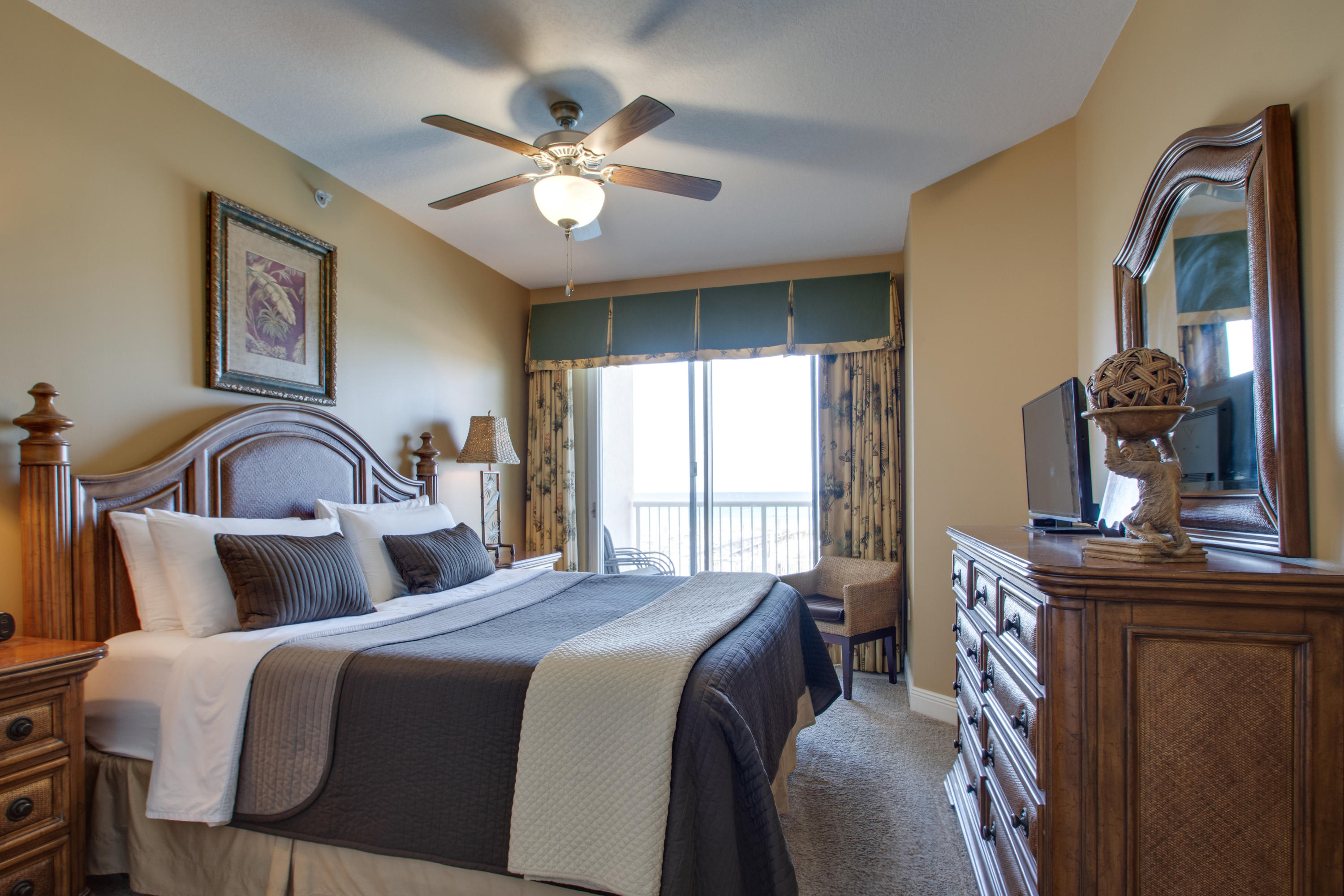 1111 Santa Rosa Boulevard, Unit 206 Fort Walton Beach, FL 32548 - Photo 14 of 46 a bedroom with a bed and a chandelier