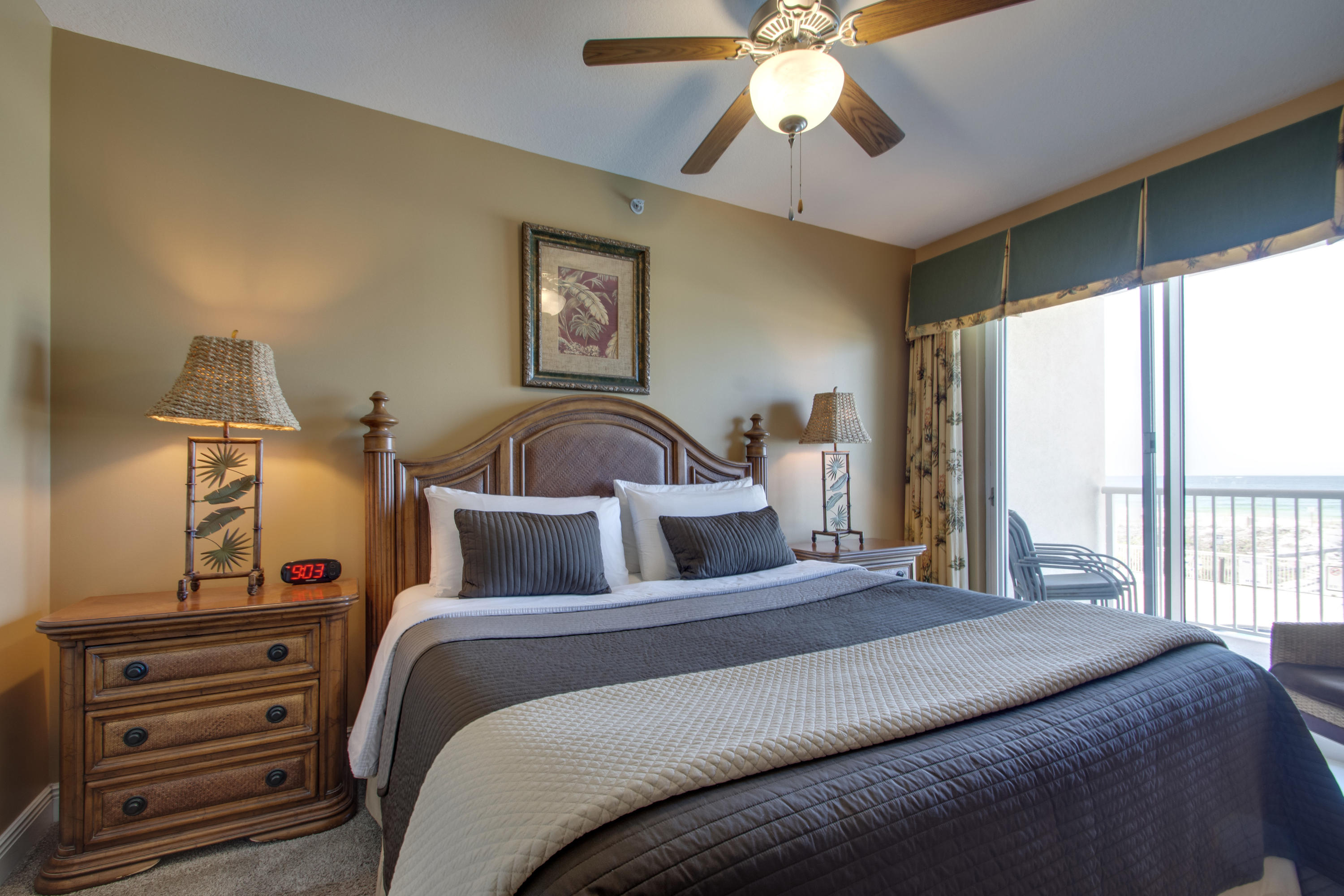 1111 Santa Rosa Boulevard, Unit 206 Fort Walton Beach, FL 32548 - Photo 15 of 46 a bedroom with a bed and a chandelier