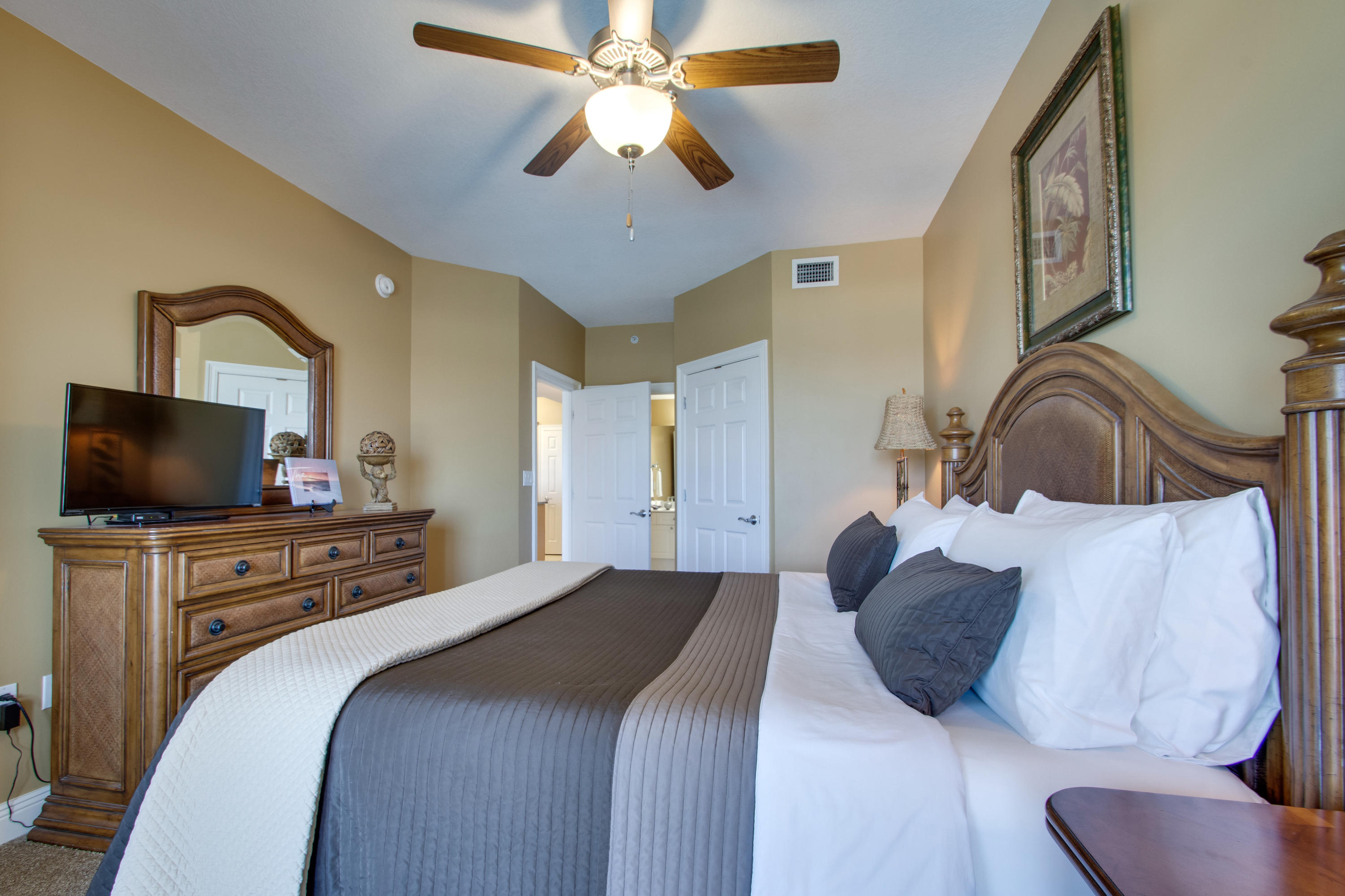 1111 Santa Rosa Boulevard, Unit 206 Fort Walton Beach, FL 32548 - Photo 17 of 46 a bedroom with a bed and a flat screen tv