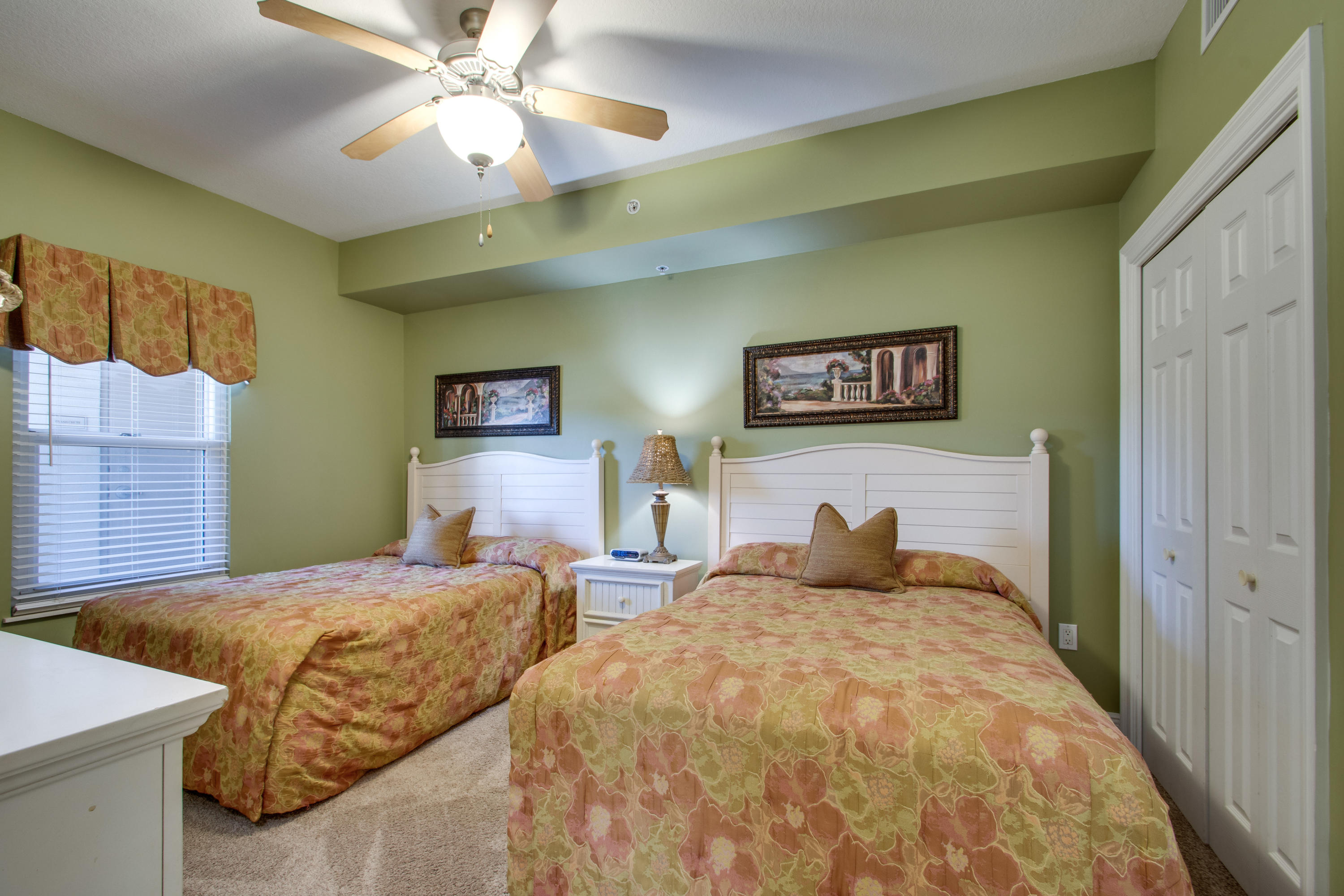 1111 Santa Rosa Boulevard, Unit 206 Fort Walton Beach, FL 32548 - Photo 19 of 46 a bedroom with double bed and a chandelier