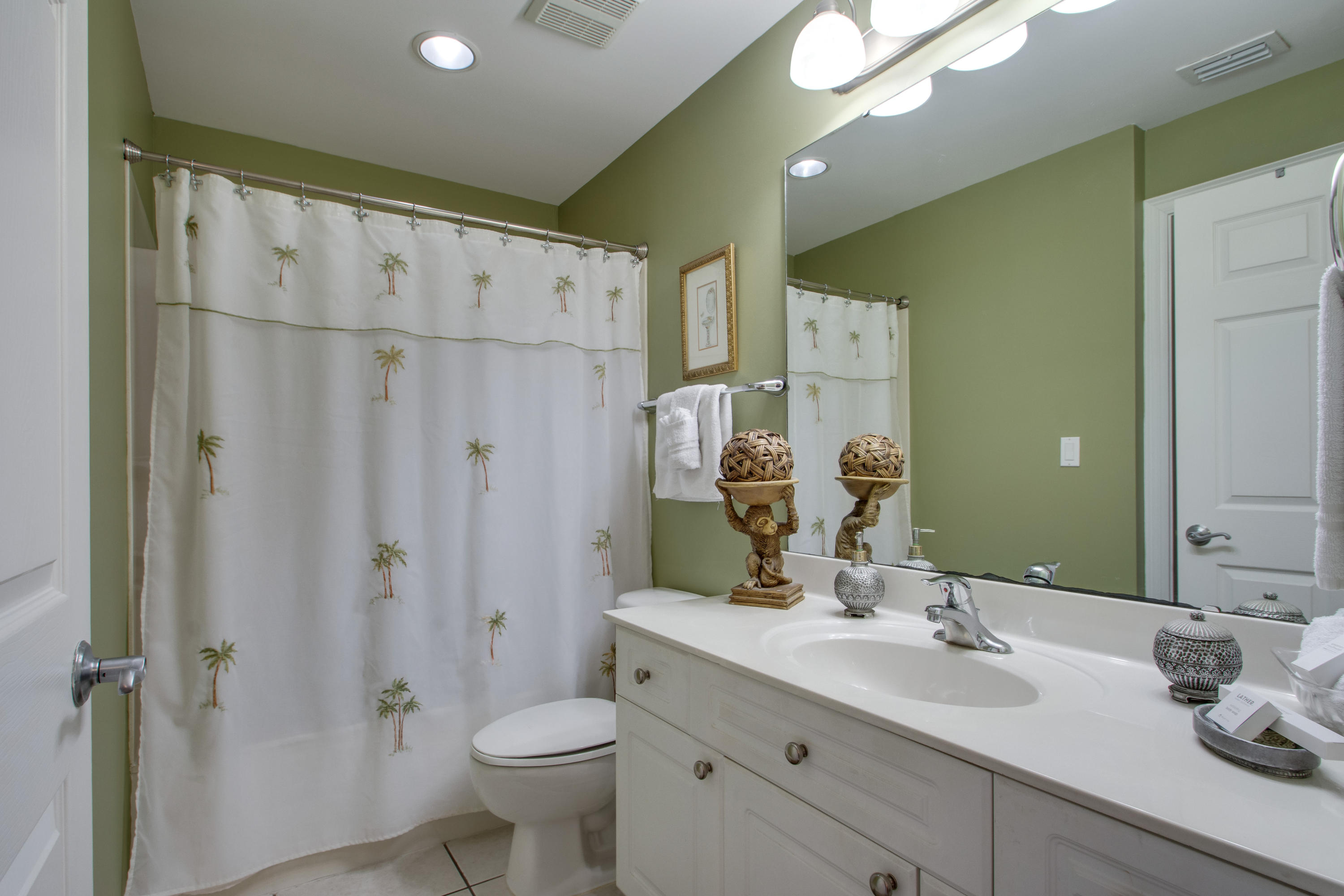 1111 Santa Rosa Boulevard, Unit 206 Fort Walton Beach, FL 32548 - Photo 20 of 46 a bathroom with a double vanity sink mirror double and shower