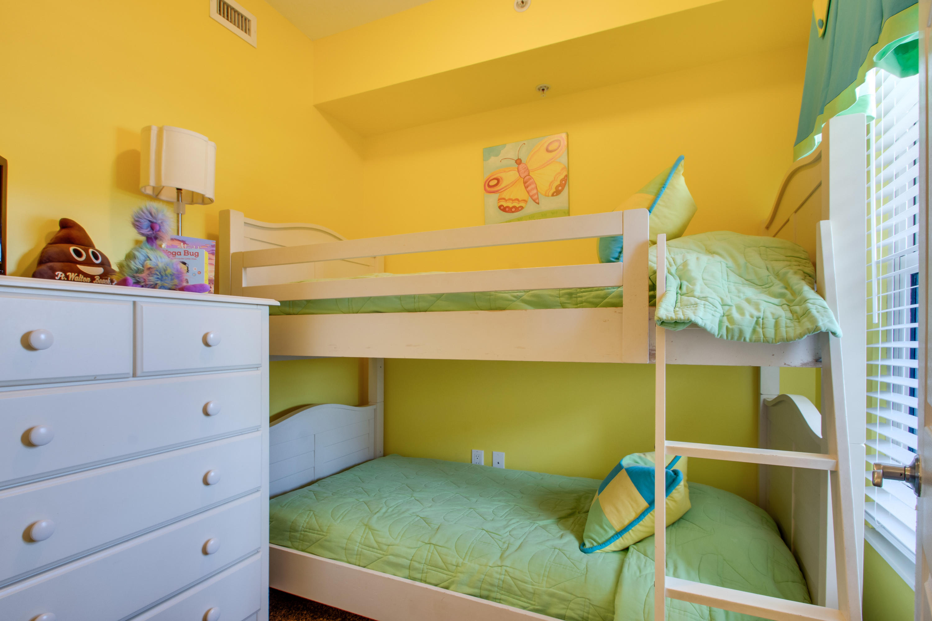 1111 Santa Rosa Boulevard, Unit 206 Fort Walton Beach, FL 32548 - Photo 21 of 46 a bedroom with a bed and a dresser