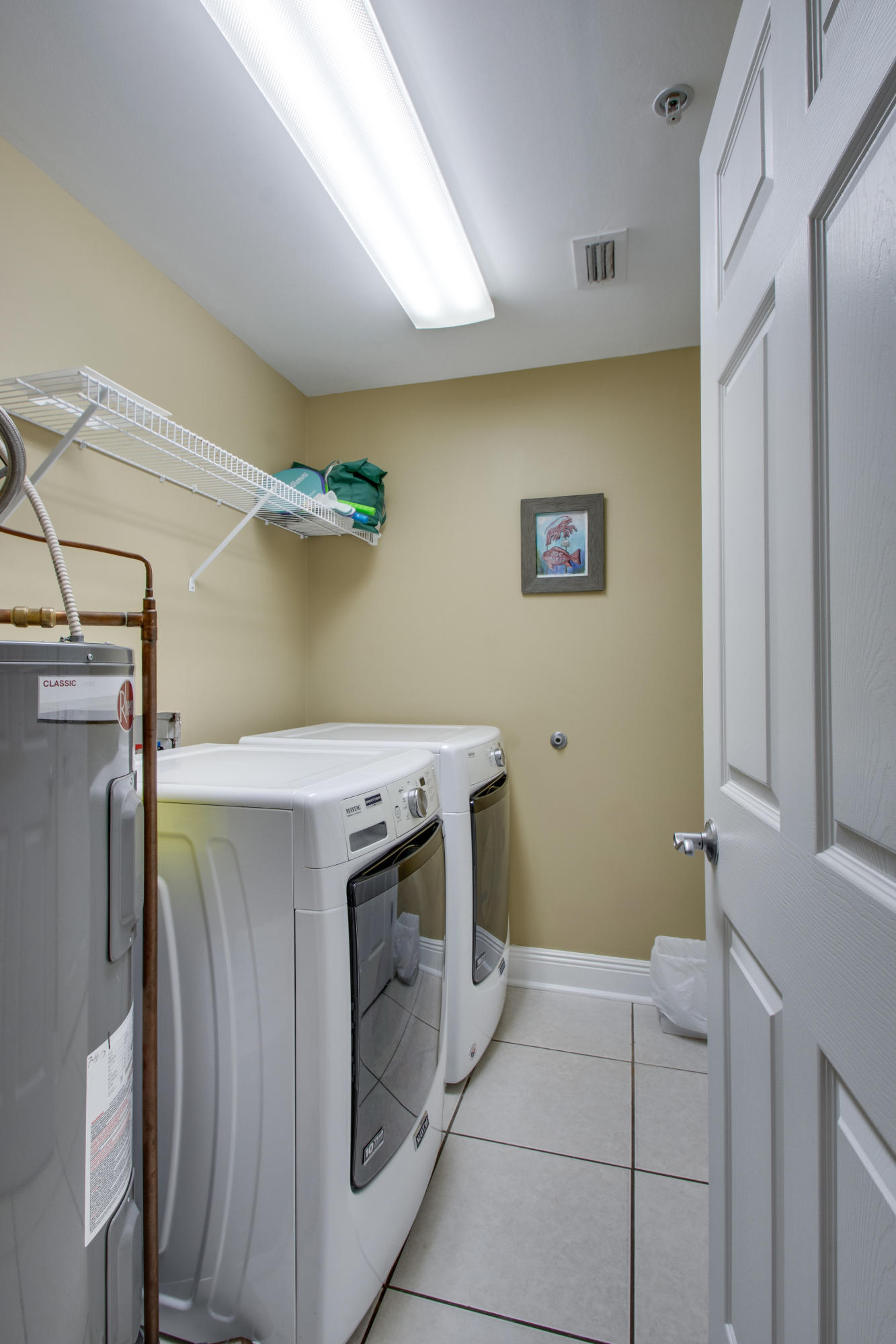 1111 Santa Rosa Boulevard, Unit 206 Fort Walton Beach, FL 32548 - Photo 22 of 46 a utility room with dryer and washer