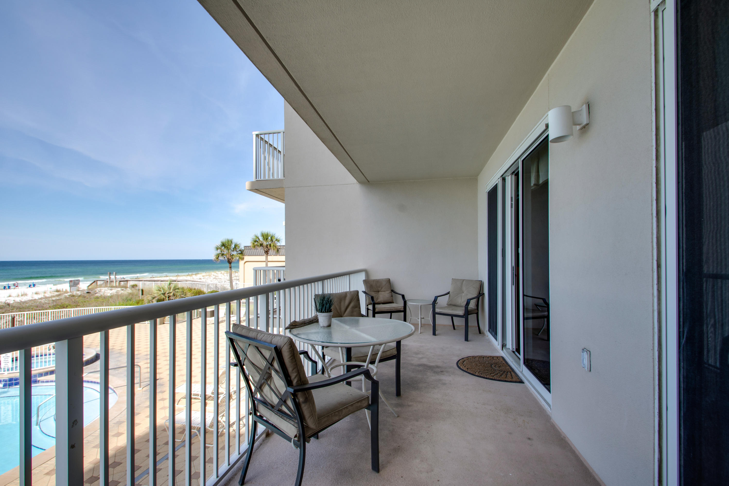 1111 Santa Rosa Boulevard, Unit 206 Fort Walton Beach, FL 32548 - Photo 24 of 46 a view of a chairs and table in patio