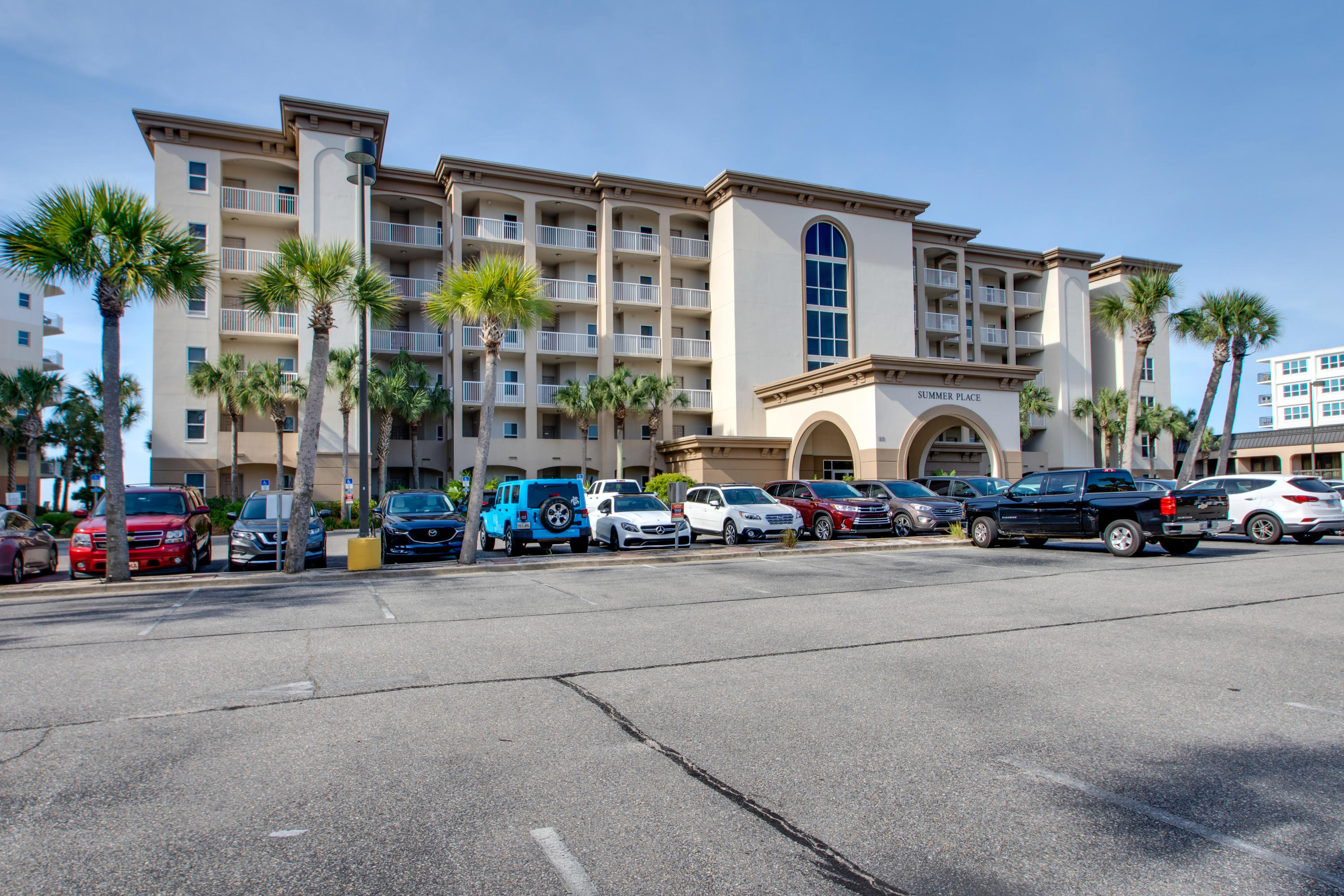 1111 Santa Rosa Boulevard, Unit 206 Fort Walton Beach, FL 32548 - Photo 33 of 46 a couple of cars parked in front of a building