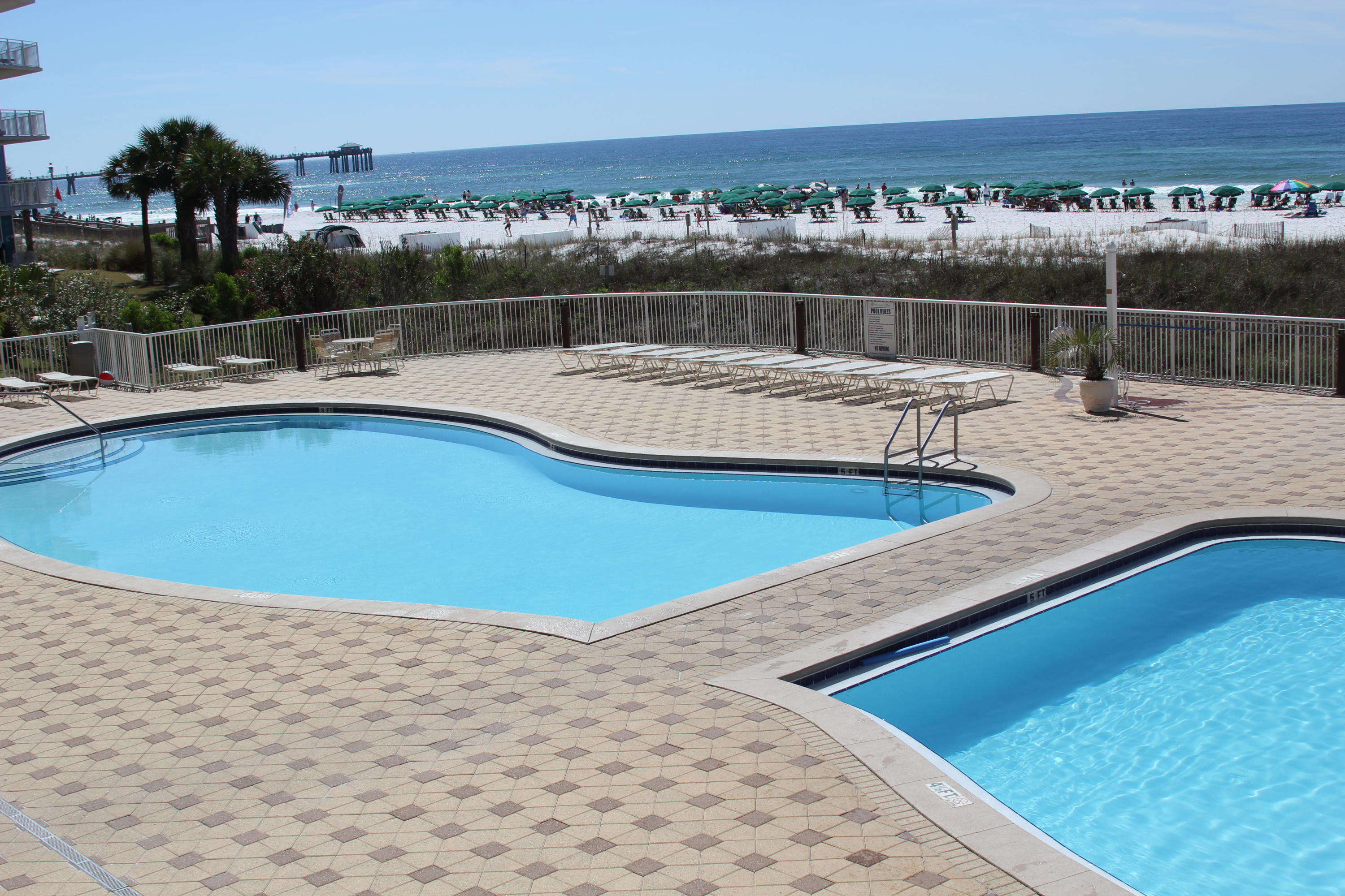 1111 Santa Rosa Boulevard, Unit 206 Fort Walton Beach, FL 32548 - Photo 34 of 46 a swimming pool is sitting in the middle of a lake