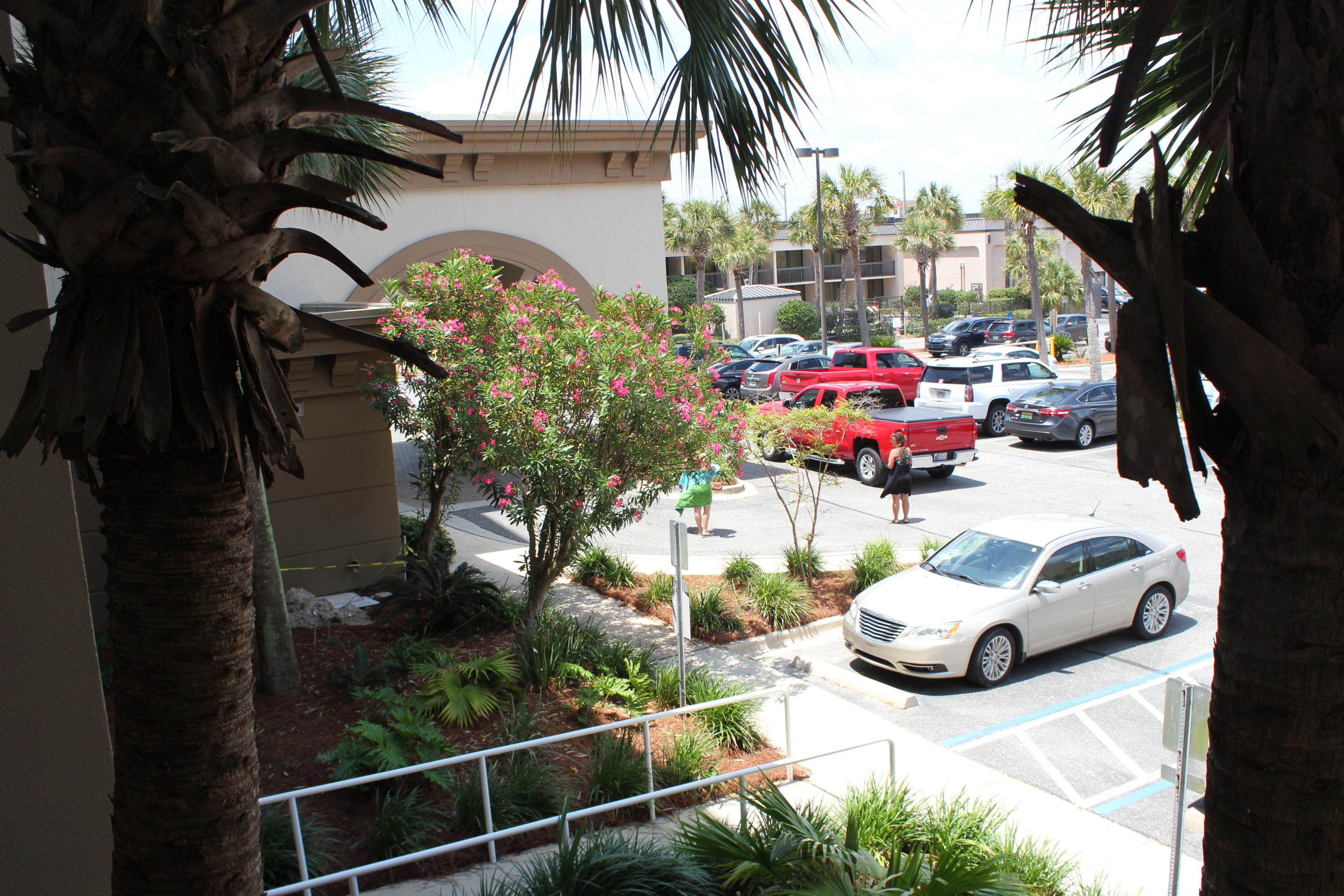 1111 Santa Rosa Boulevard, Unit 206 Fort Walton Beach, FL 32548 - Photo 43 of 46 a couple of cars parked in front of a house