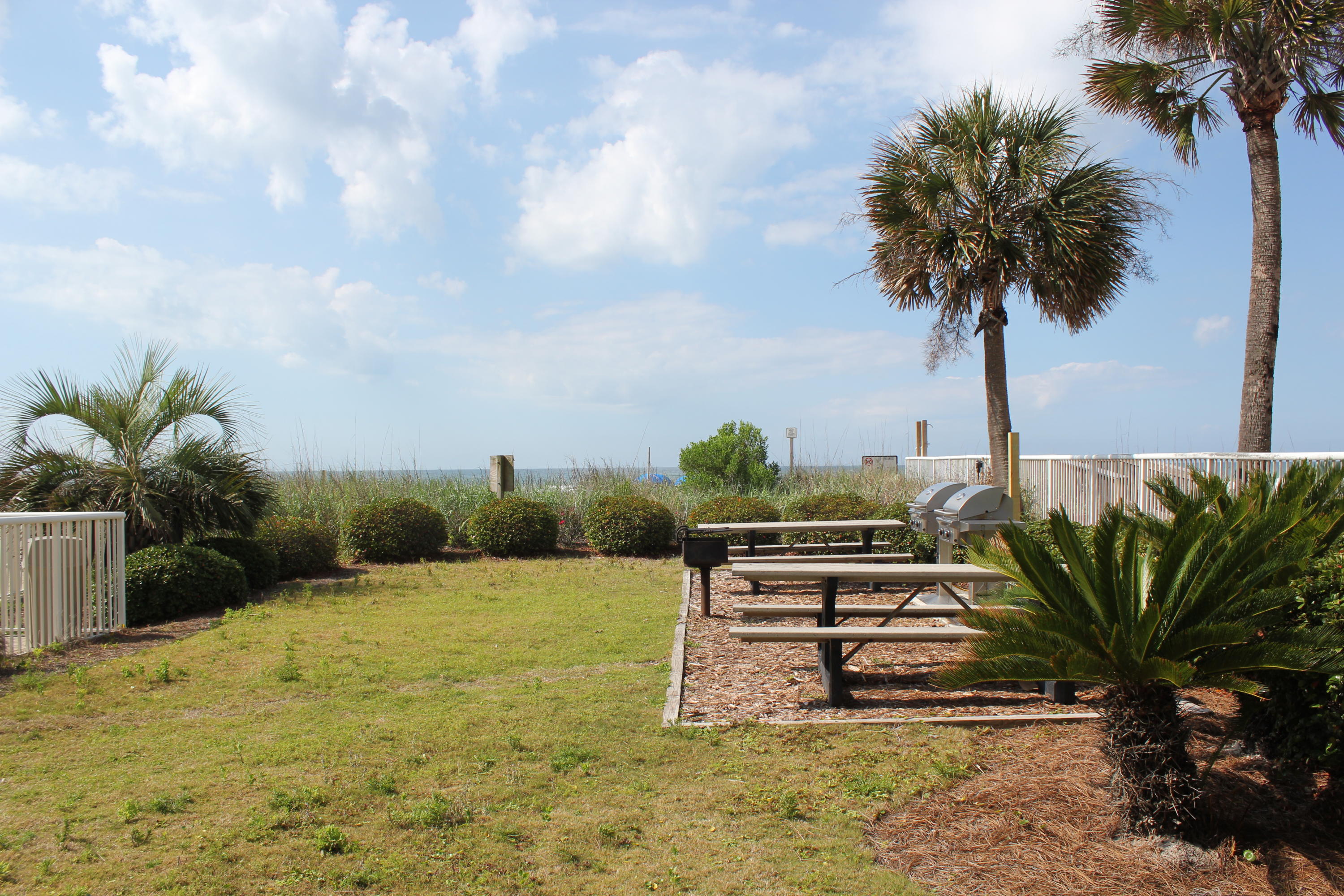 1111 Santa Rosa Boulevard, Unit 206 Fort Walton Beach, FL 32548 - Photo 46 of 46 a view of a swimming pool with a garden