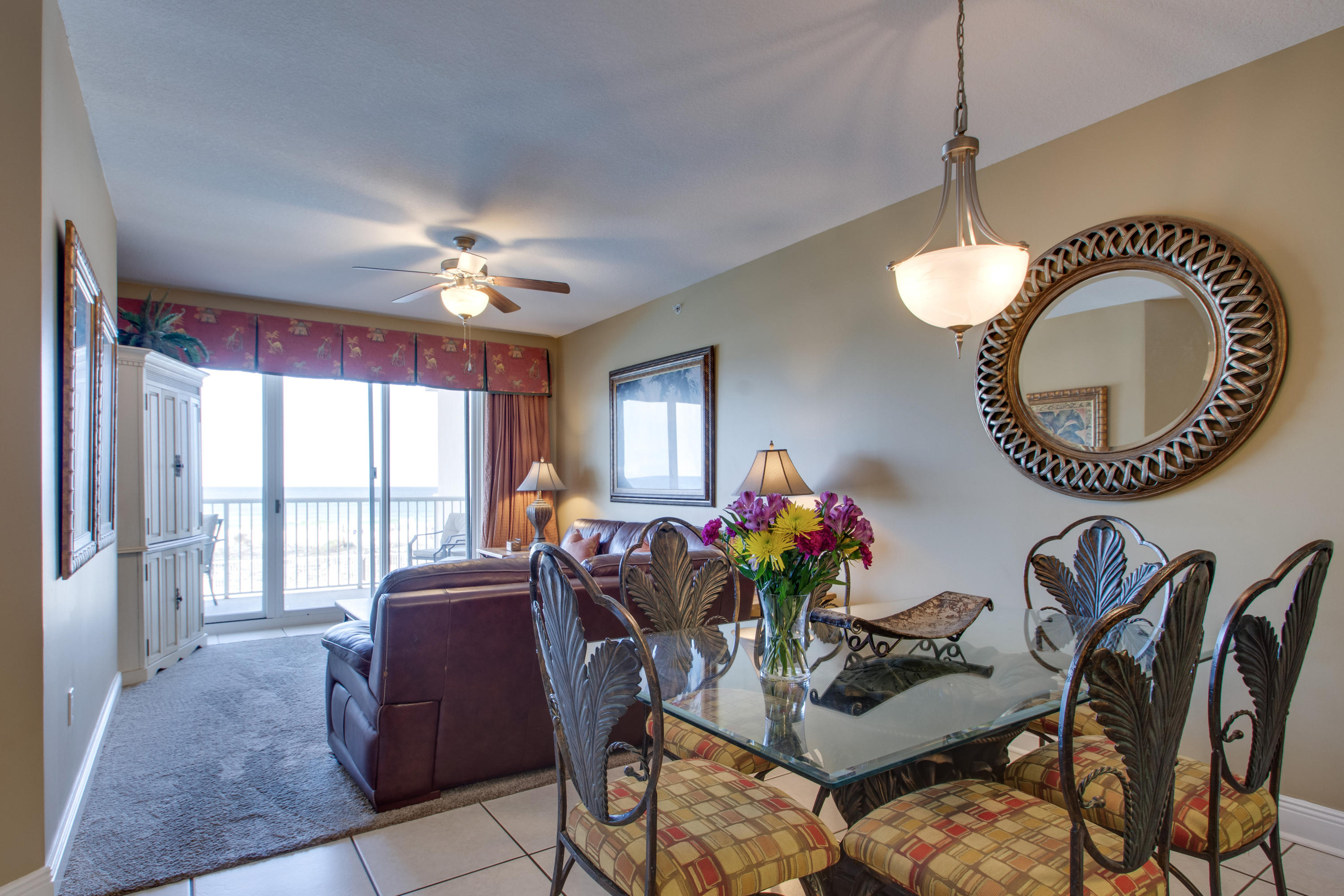 1111 Santa Rosa Boulevard, Unit 206 Fort Walton Beach, FL 32548 - Photo 9 of 46 a dining room with furniture a chandelier and a rug