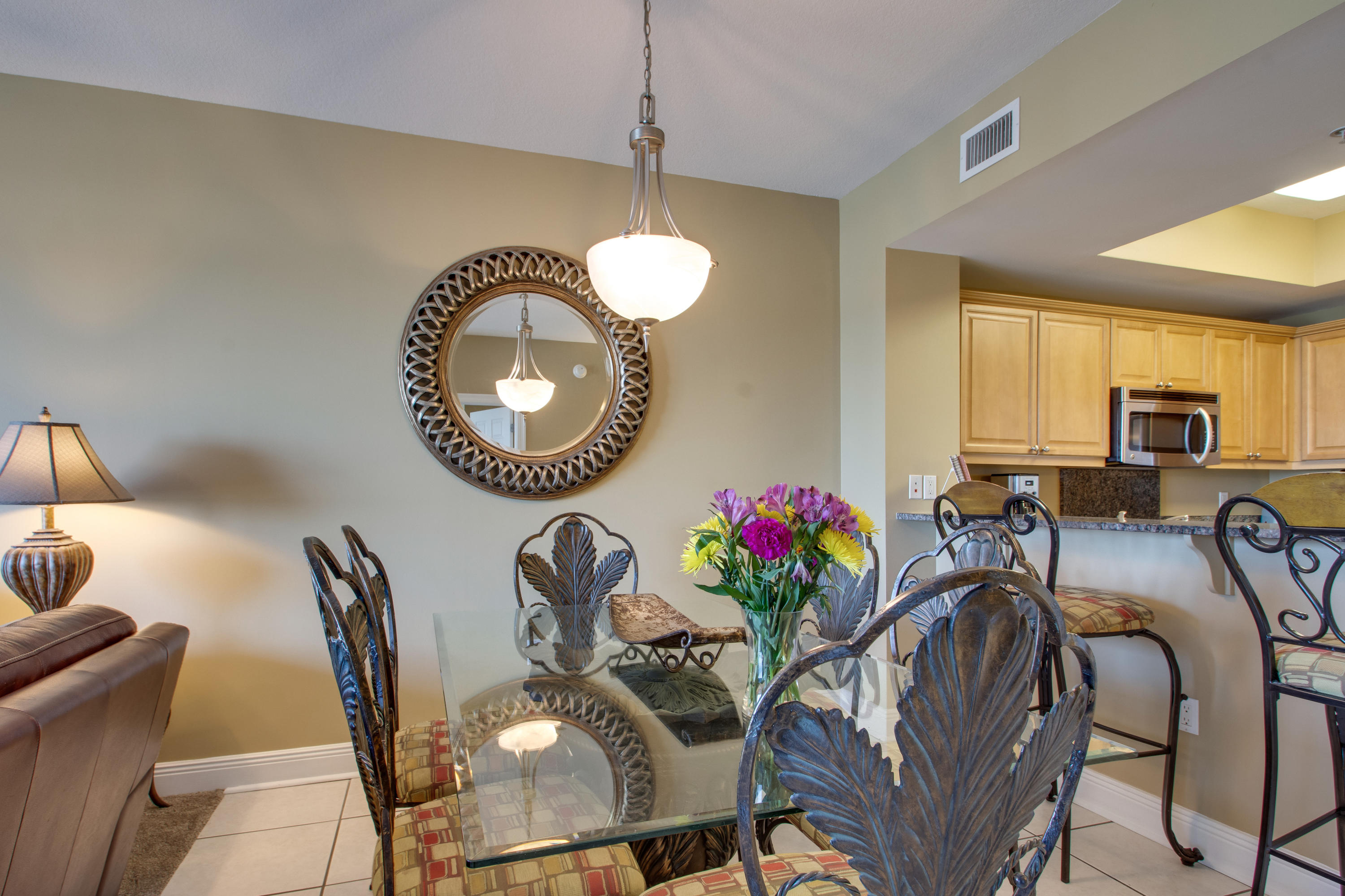1111 Santa Rosa Boulevard, Unit 206 Fort Walton Beach, FL 32548 - Photo 10 of 46 a view of a dining room with furniture and a chandelier