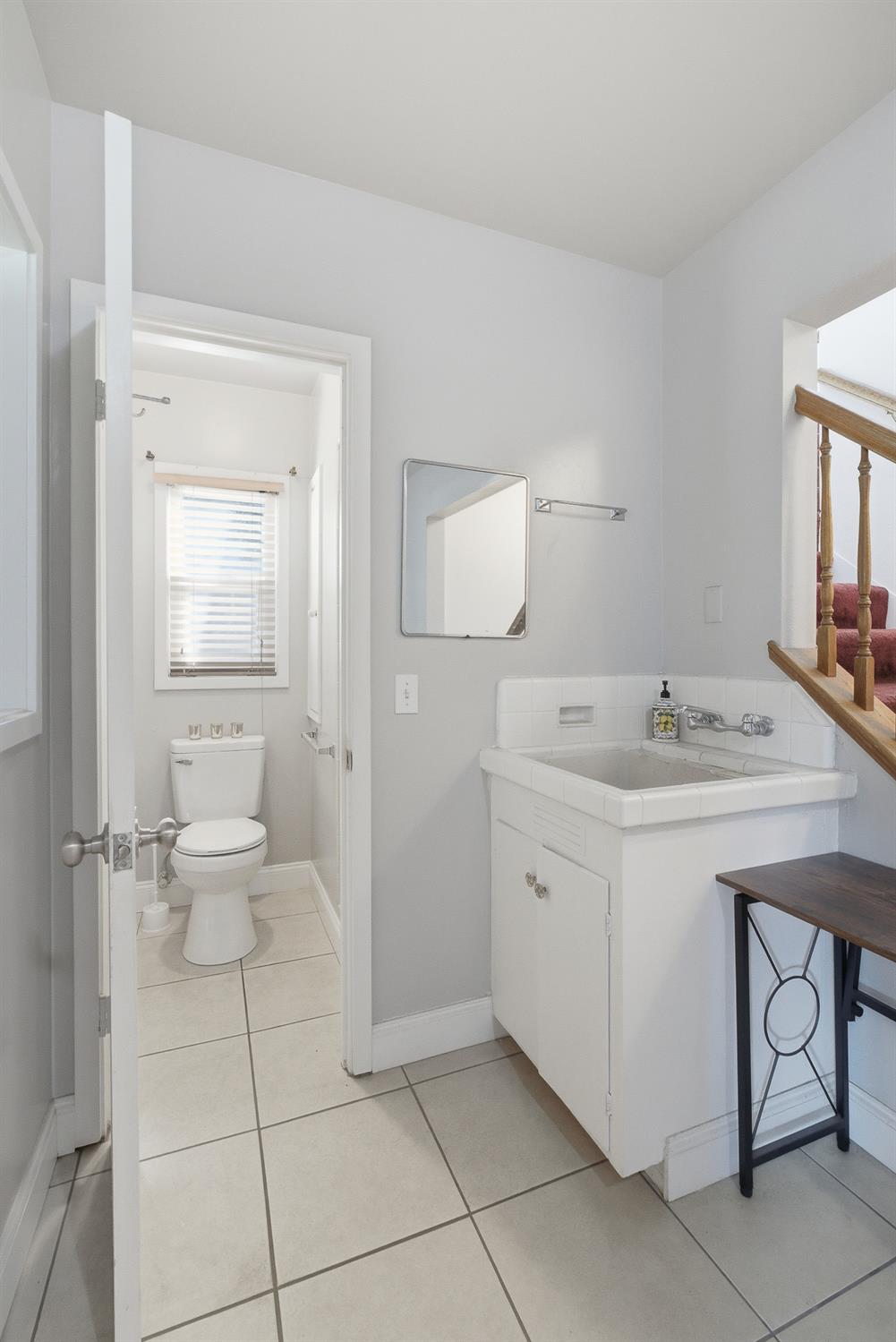 574 North Frankwood Avenue Reedley, CA 93654 - Photo 25 of 37 a spacious bathroom with a toilet sink and mirror
