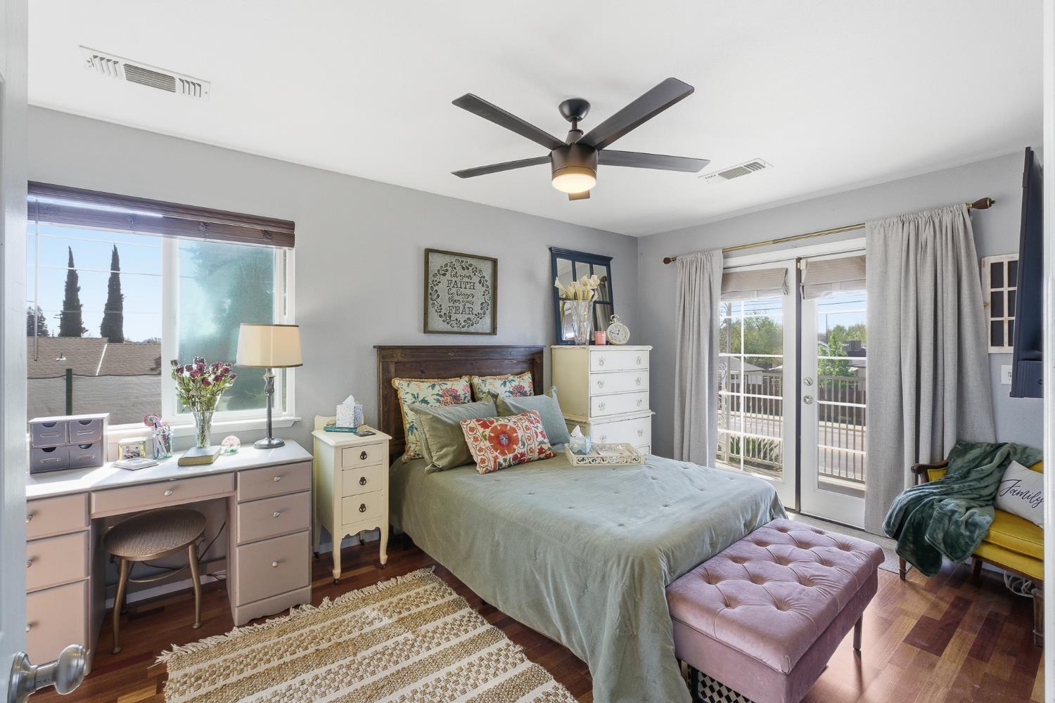 574 North Frankwood Avenue Reedley, CA 93654 - Photo 26 of 37 a bedroom with a bed a couch and a window