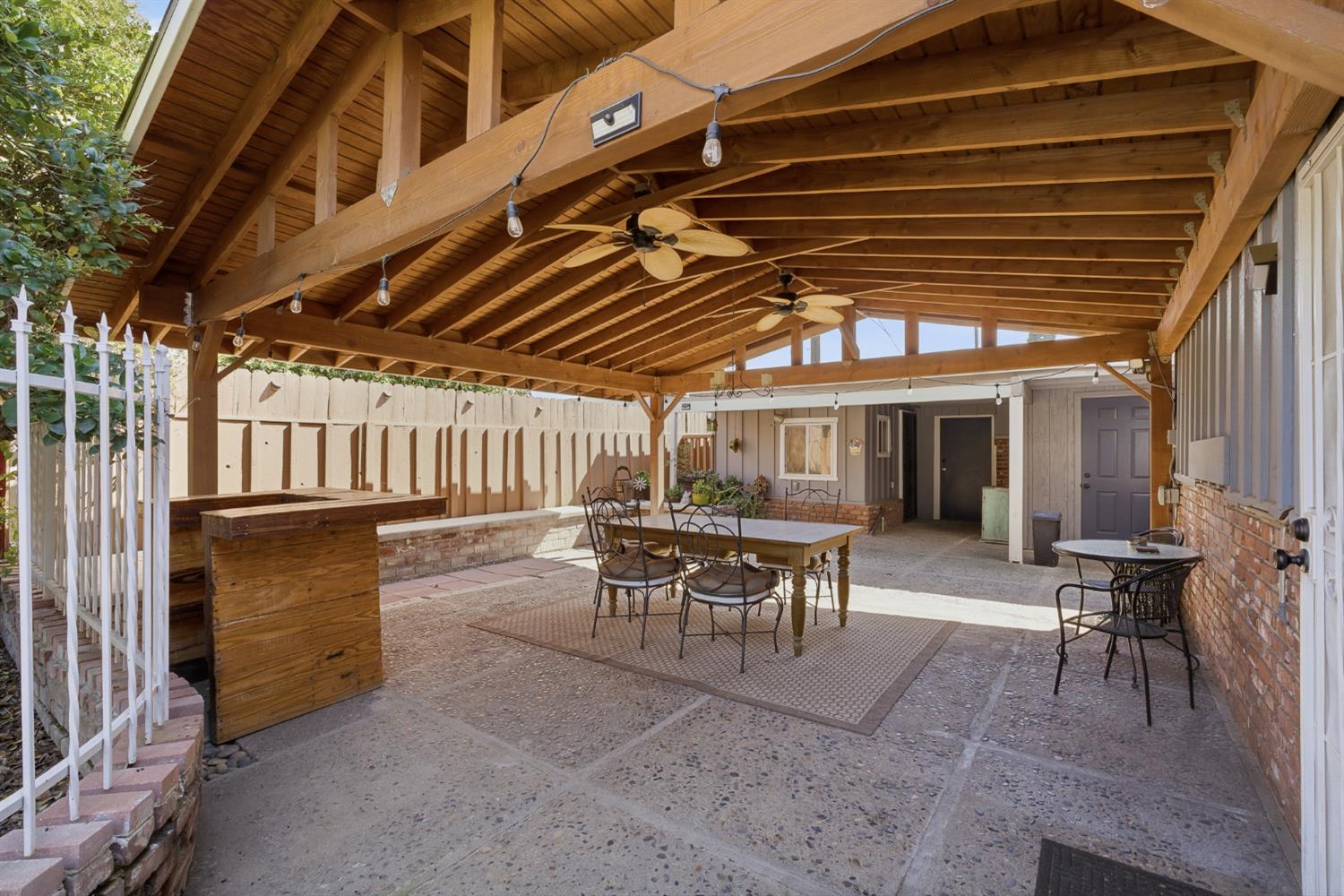 574 North Frankwood Avenue Reedley, CA 93654 - Photo 31 of 37 a view of a chairs and table in the patio