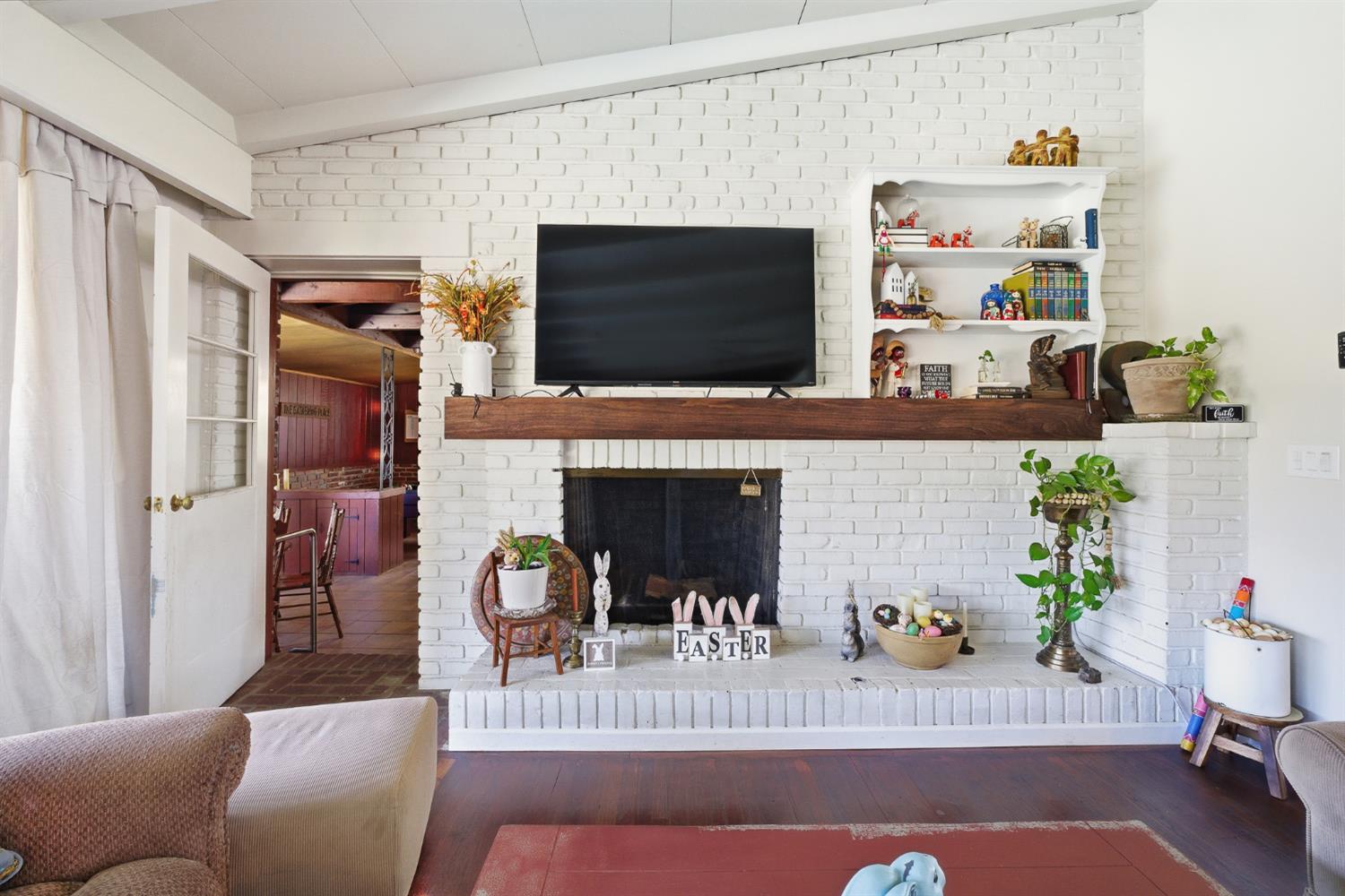 574 North Frankwood Avenue Reedley, CA 93654 - Photo 9 of 37 a living room with furniture and a flat screen tv