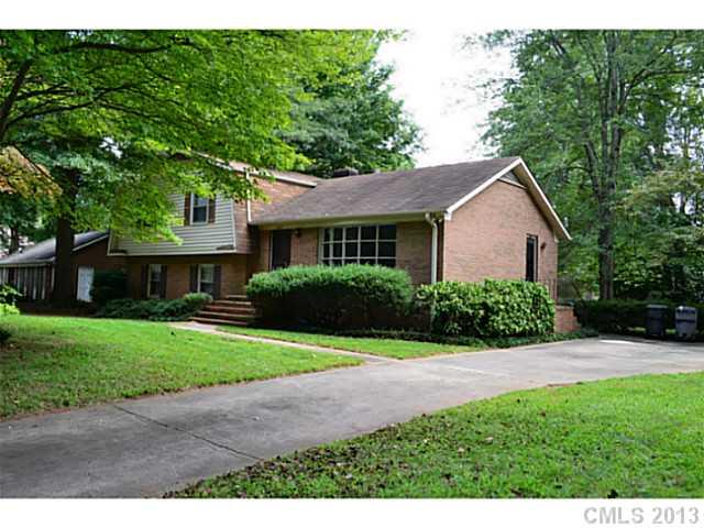 1447 McIlroy Road Charlotte, NC 28212 - Photo 2 of 12 a front view of a house with a yard and porch