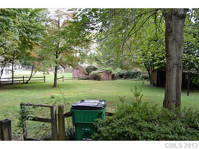 1447 McIlroy Road Charlotte, NC 28212 - Photo 3 of 12 a view of a park with large trees